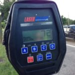 A police radar gun displays a speed