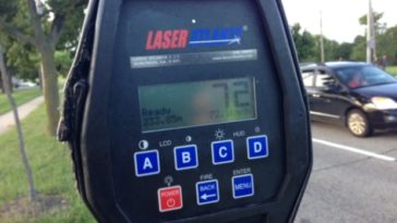 A police radar gun displays a speed