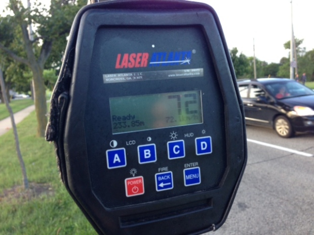 A police radar gun displays a speed
